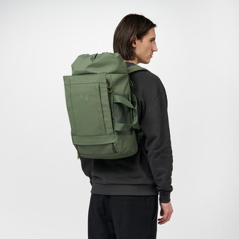 Pinqponq Blok Medium Backpack Forester Olive model man rug