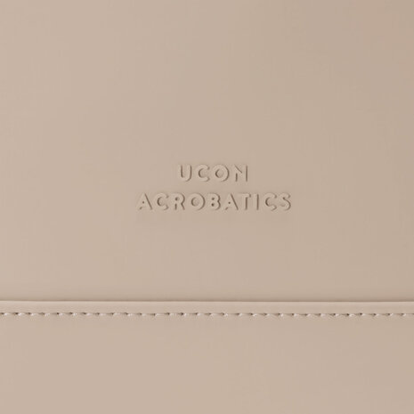Ucon Acrobatics Lotus Infinity Yuto Medium Backpack Sand logo