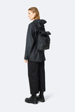 Rains Roll Top Mini Backpack Black model vrouw zijkant