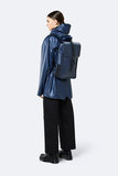 Rains Backpack Mini Shiny Blue model vrouw zijkant